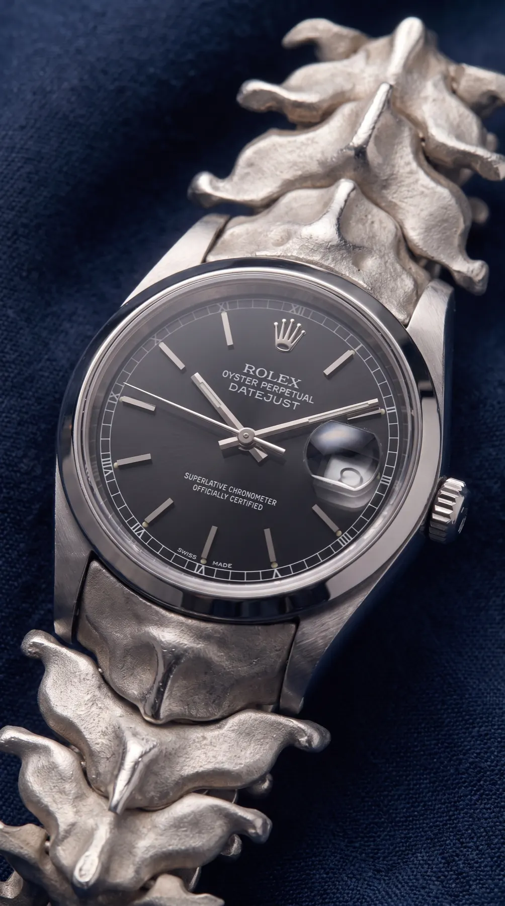 Vertical composition of Rolex on vertebrae-like bracelet
